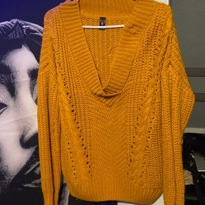 A mustard yellow knitted top